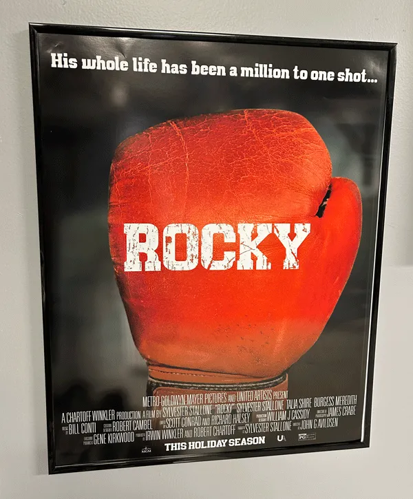 Different steps of the logo's creation with the hand drawn sketch on top, the red digital illustration in the middle, and the digital illustration in front of a black background on the bottom.