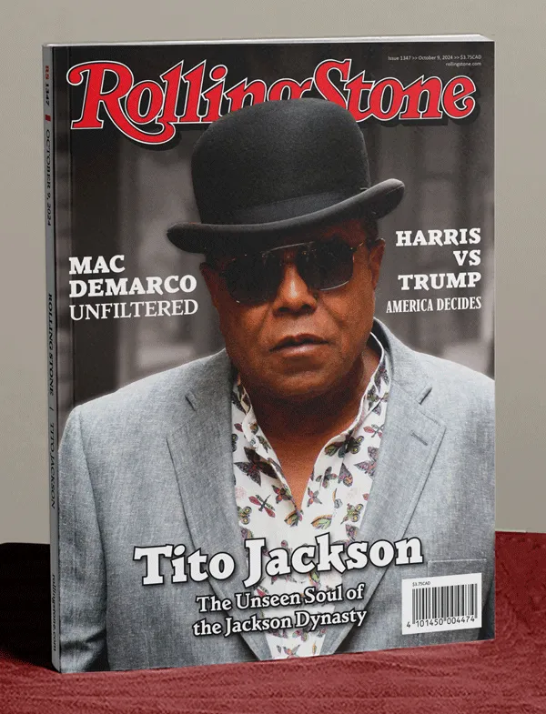 Rolling Stone magazine mockup standing on end on a table, featuring Tito Jackson on the cover.