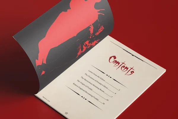 Mockup of the zine open face-up with the front cover peeled back to display the silhouette graphic of Freddy on the other side. On the right is the table of contents. All is presented on a crimson table surface.